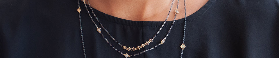Amali necklaces on model