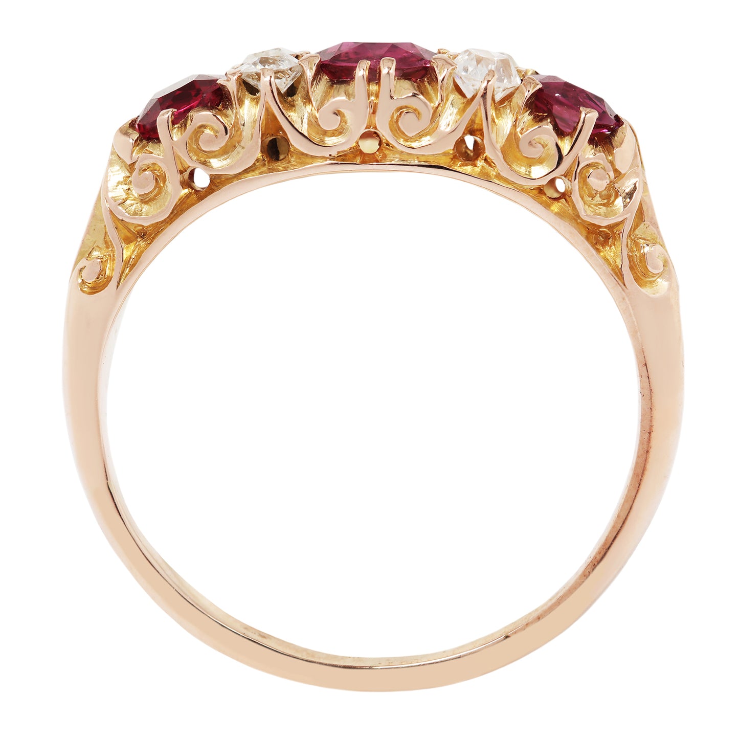 Gold ring with red gemstones on a white background