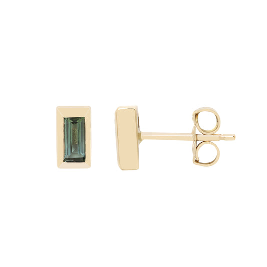 A pair of gold rectangular stud earrings, one shown from the front with a green baguette-cut gemstone and the other from the side showing the post and butterfly back, on a plain white background.