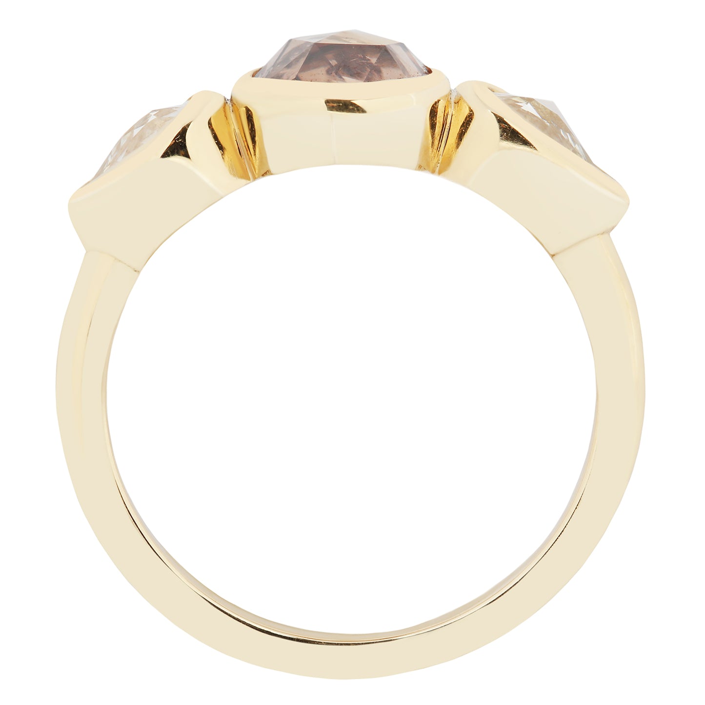 Gold ring with a three gemstones on a white background