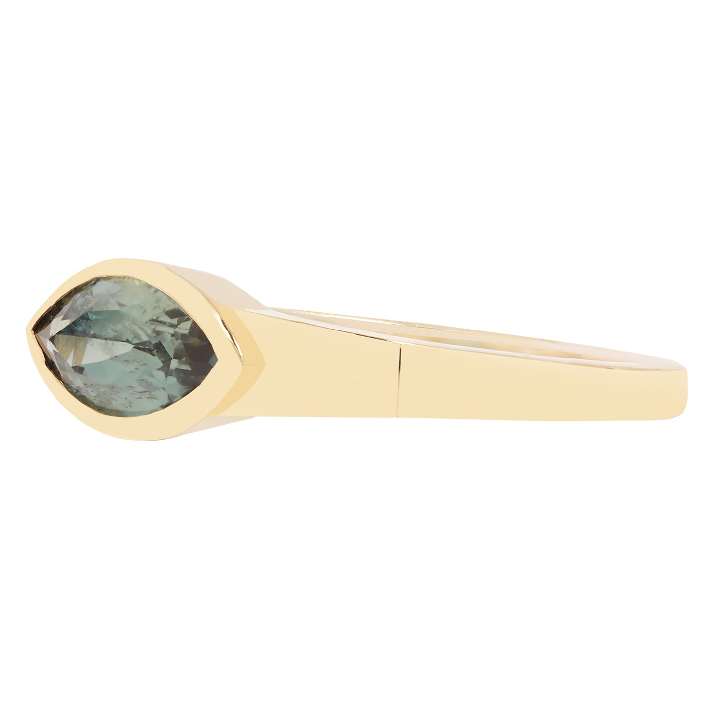 Lauren Wolf - Gold ring with a green gemstone on a white background
