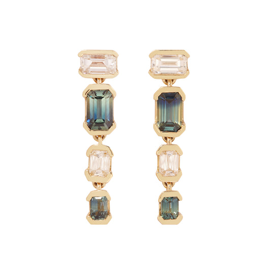 Gold earrings with multicolored gemstones on a white background