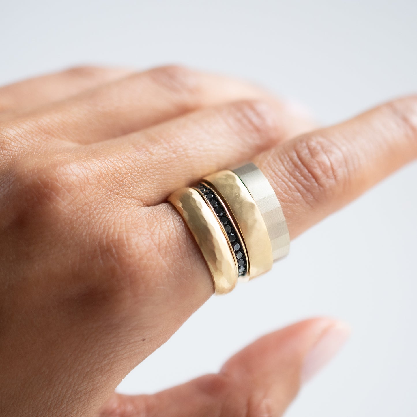 Satomi Kawakita - Stack of multiple rings on hand