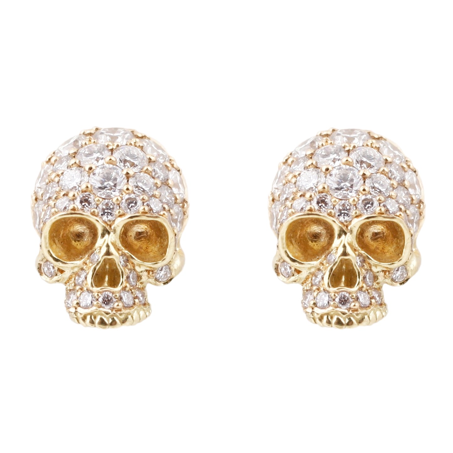 Anthony Lent 18k yellow gold skull studs covered in white pavé diamonds.