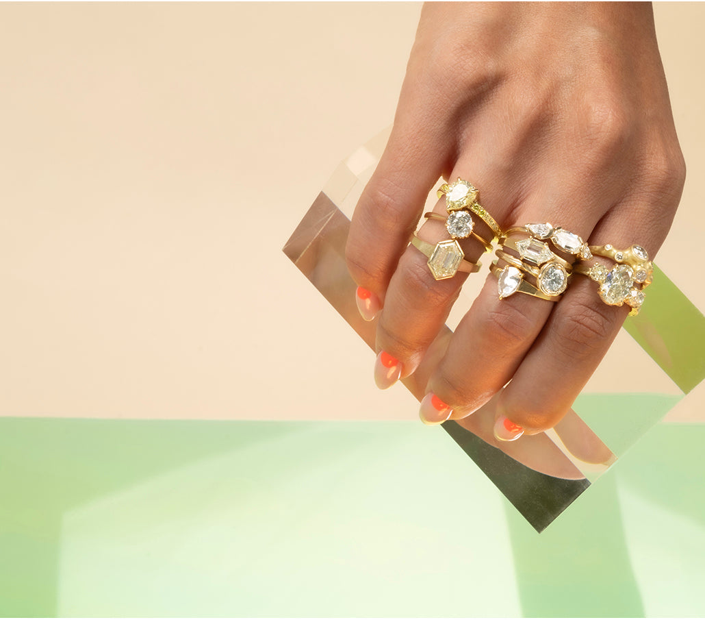Rings Category - Assortment of gold and diamond rings on hand