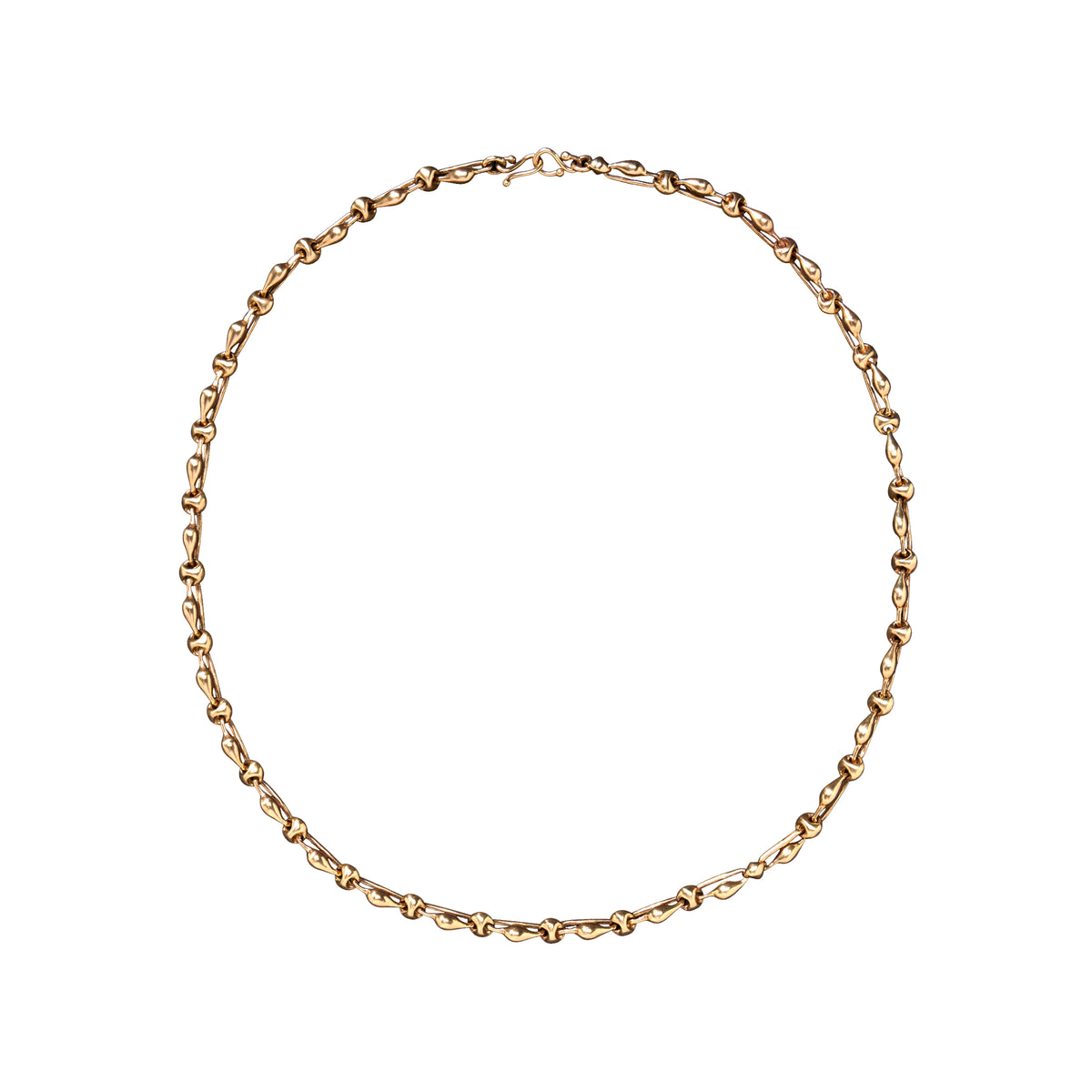 A delicate yellow gold chain necklace with a small clasp, arranged in a circle on a solid white background.