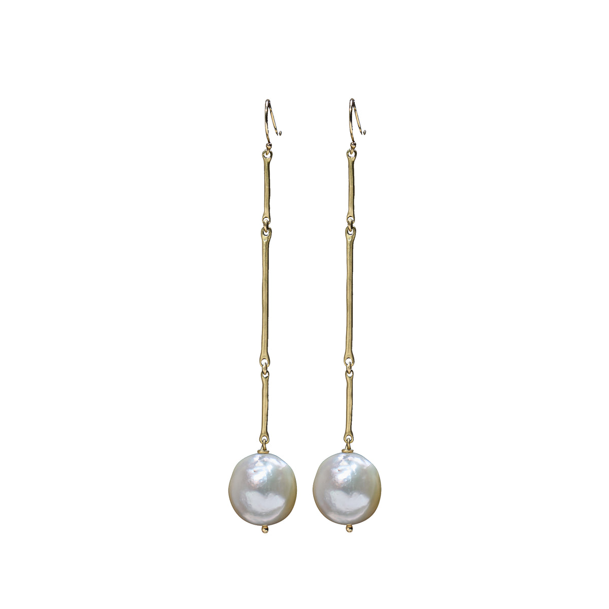 A pair of gold drop earrings with a textured vertical bar, a small bead, and a round white baroque pearl hanging from the end, shown against a plain white background.