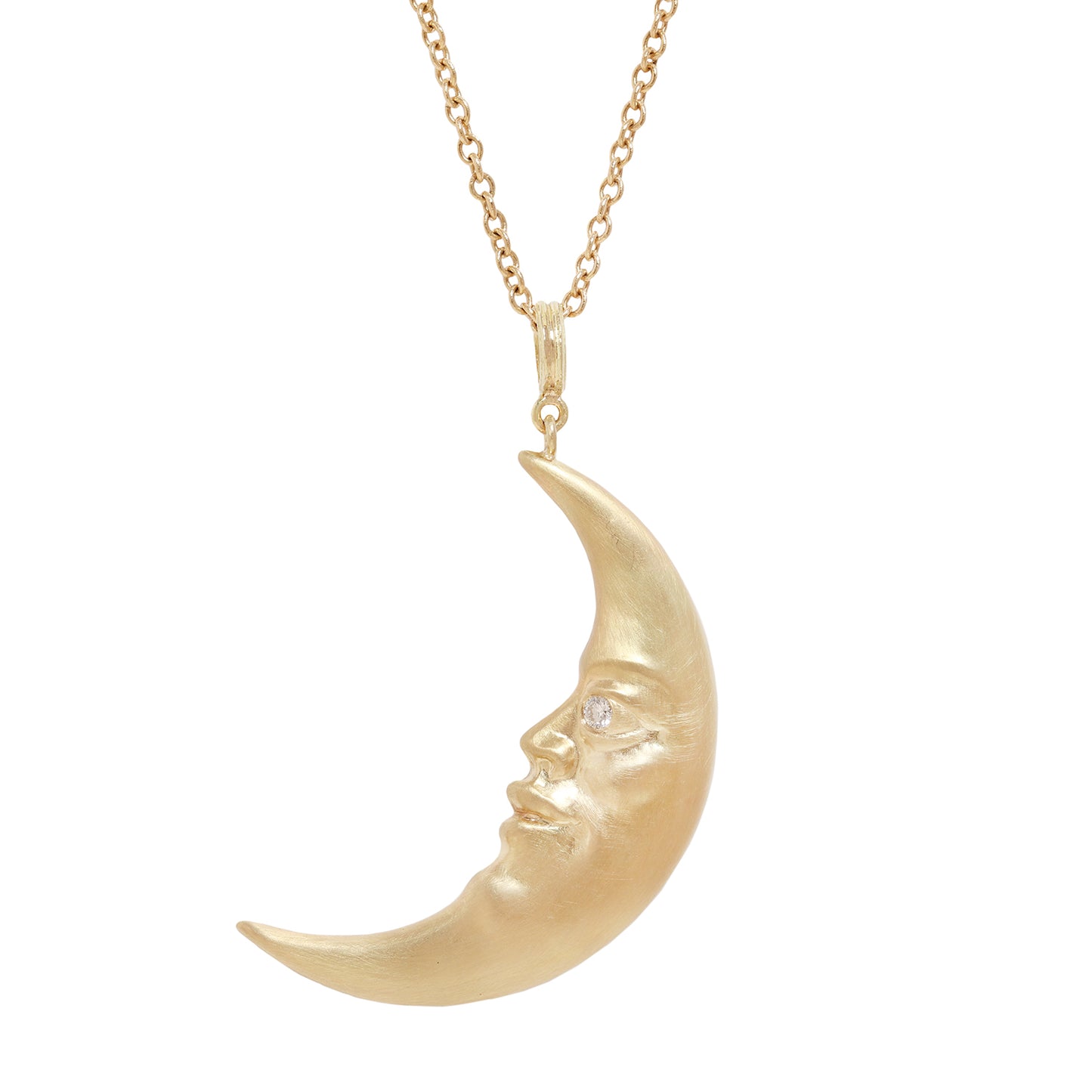 A gold crescent moon pendant necklace with a sculpted face and a small clear diamond in one eye, suspended from a delicate gold chain against a plain white background.