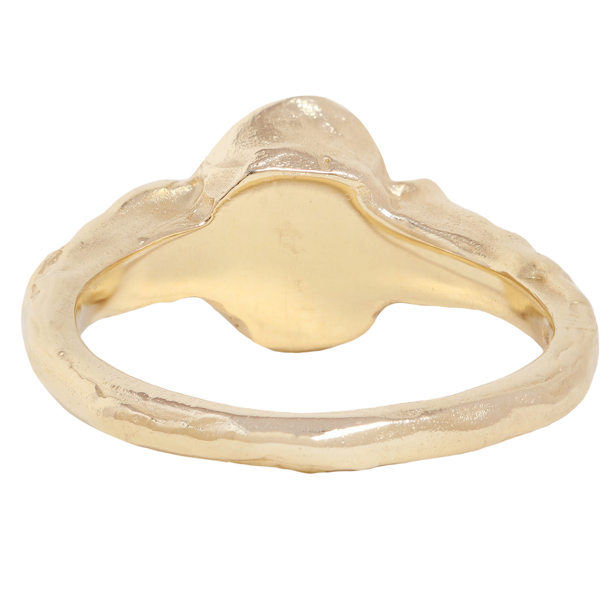 A yellow gold ring featuring a large oval-cut clear center stone and two baguette-cut side stones, shown on a plain white background.