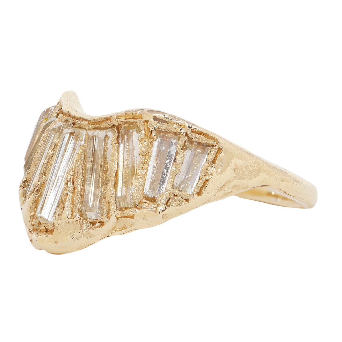 A gold ring featuring a wavy, organic shape with multiple baguette-cut clear diamonds set across the top, shown against a plain white background.