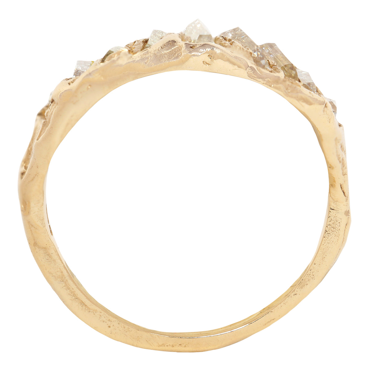 A gold ring with a textured, organic-shaped band and a row of clear, faceted gemstones along the top, shown against a plain white background.