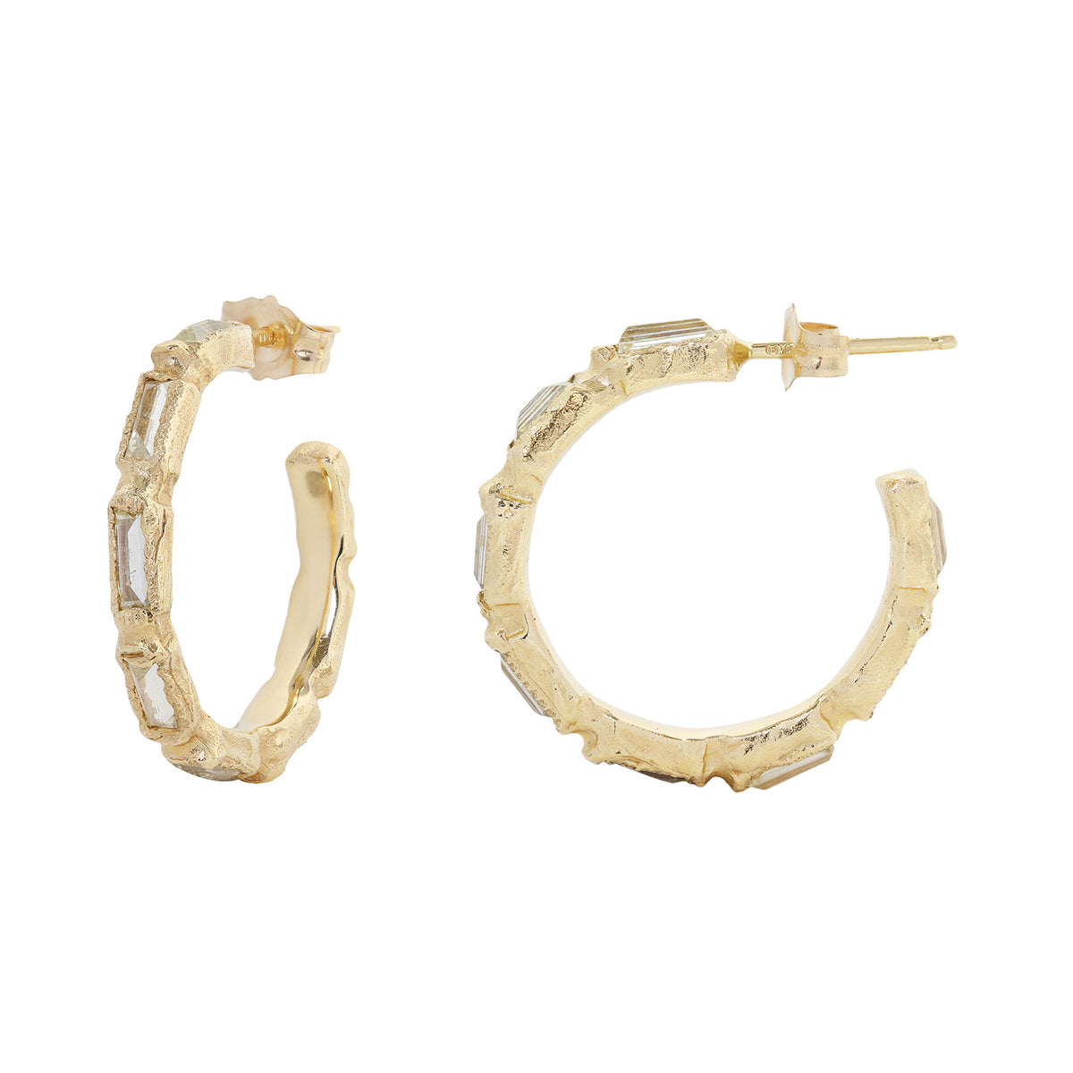 Textured gold and diamond hood earring on white background