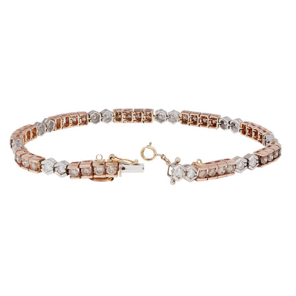 Rose gold and white gold diamond tennis bracelet on a white background