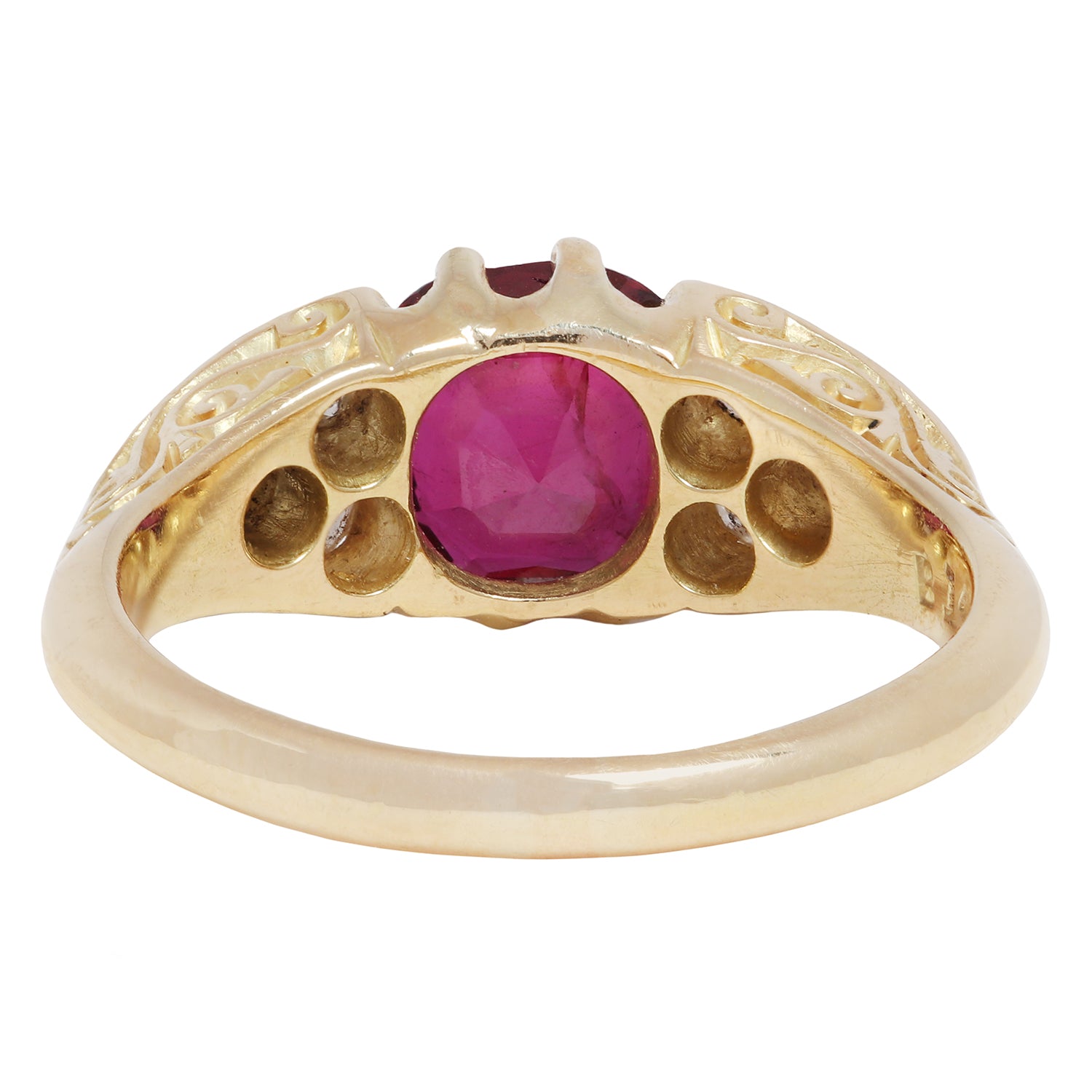 Antique Gold ring with a red ruby and diamond accents on a white background