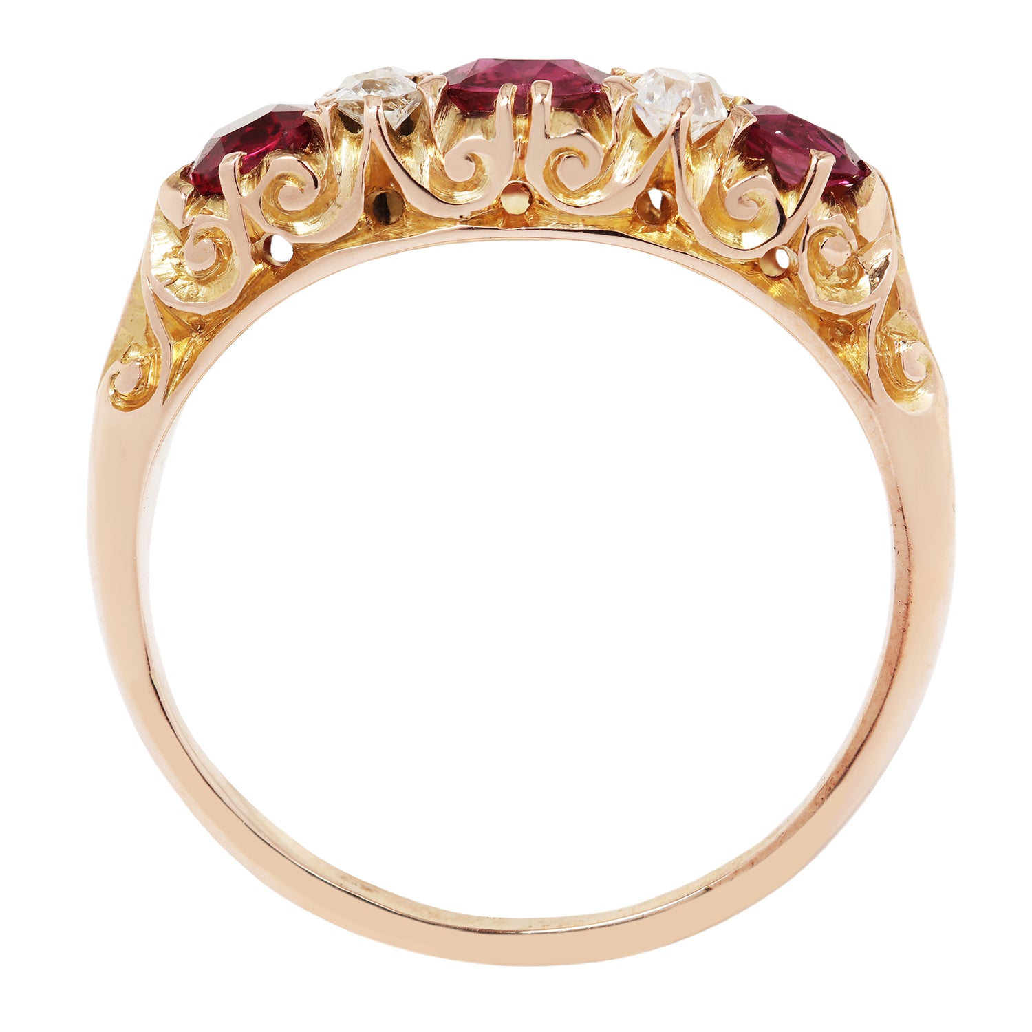Gold ring with red gemstones on a white background