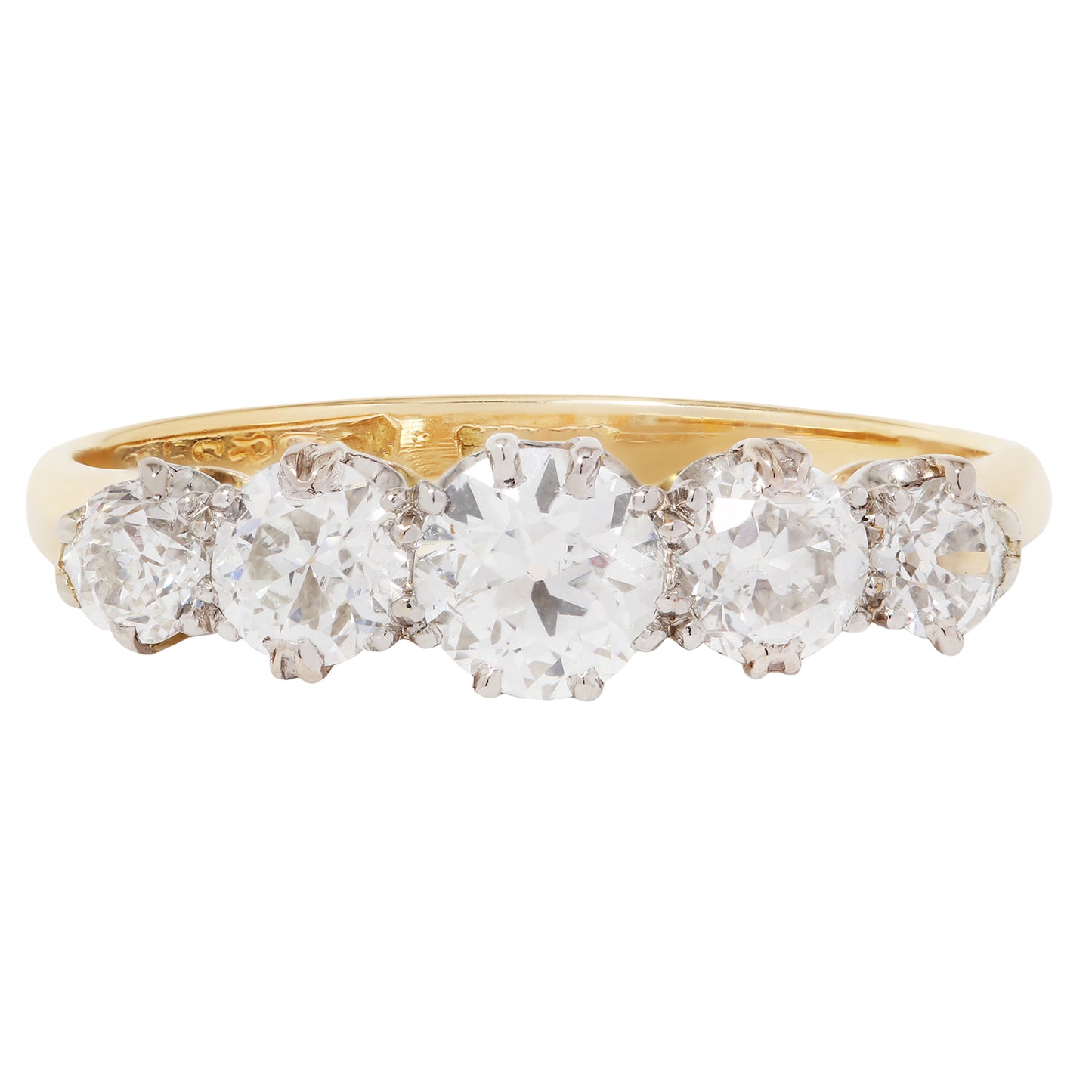 Gold ring with five diamonds on a white background
