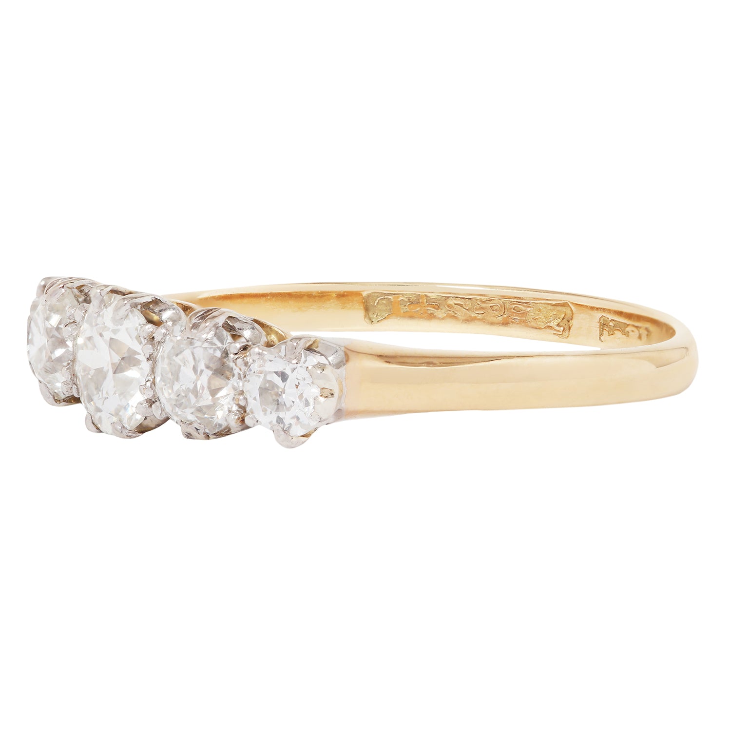 Gold ring with three diamonds on a white background
