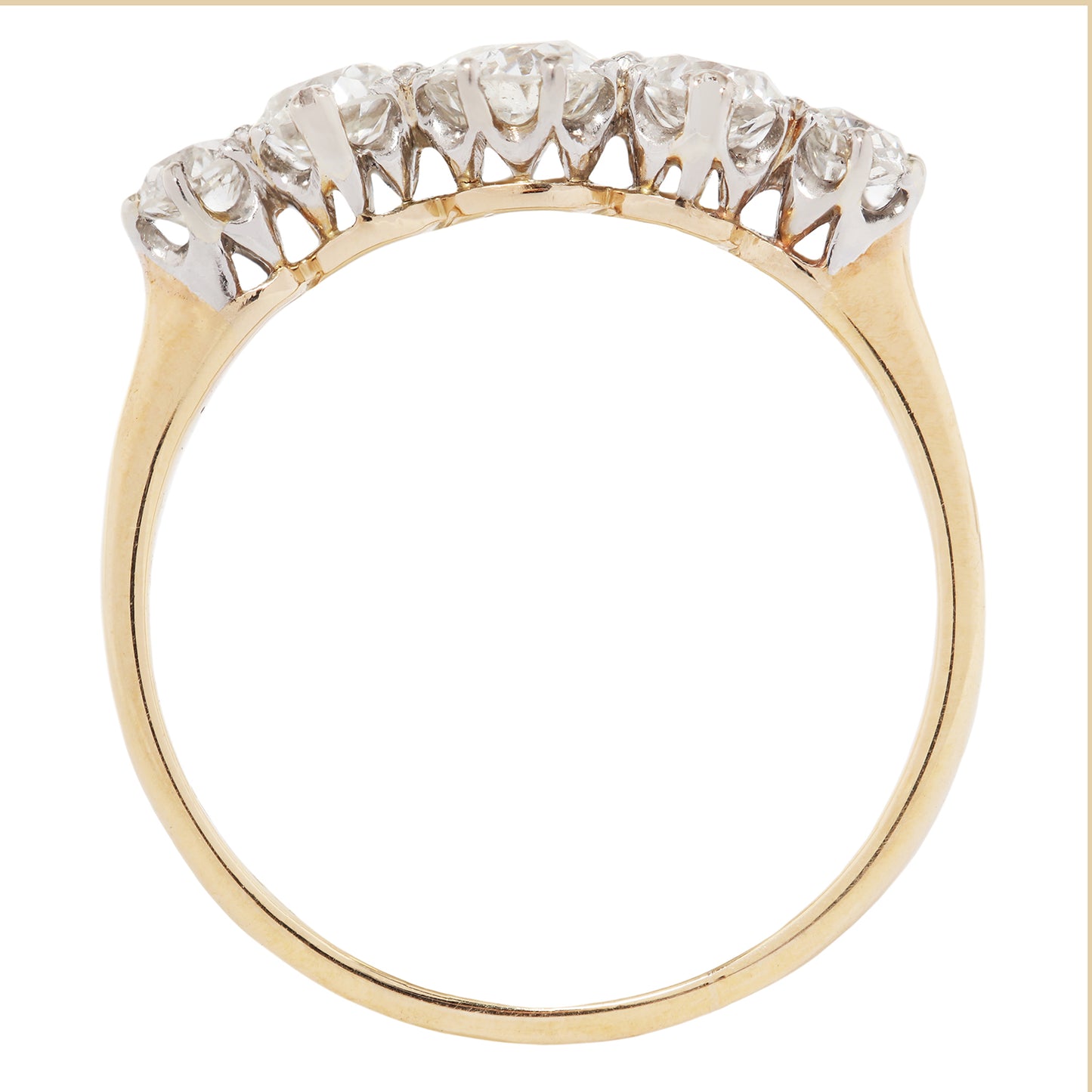 Gold ring with diamonds on a white background