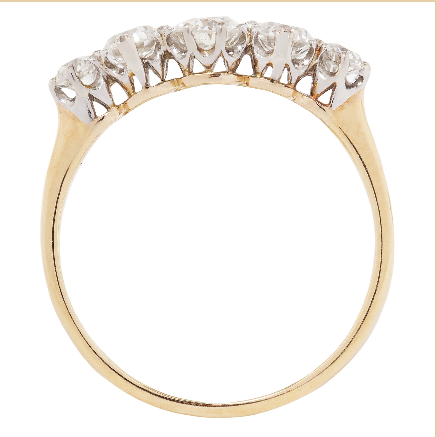Gold ring with diamonds on a white background