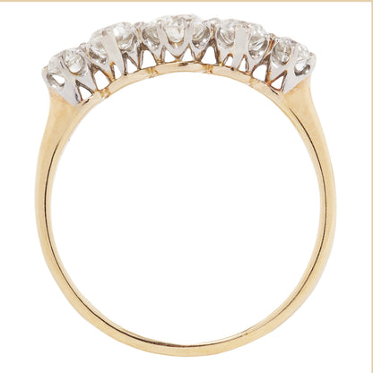 Gold ring with diamonds on a white background