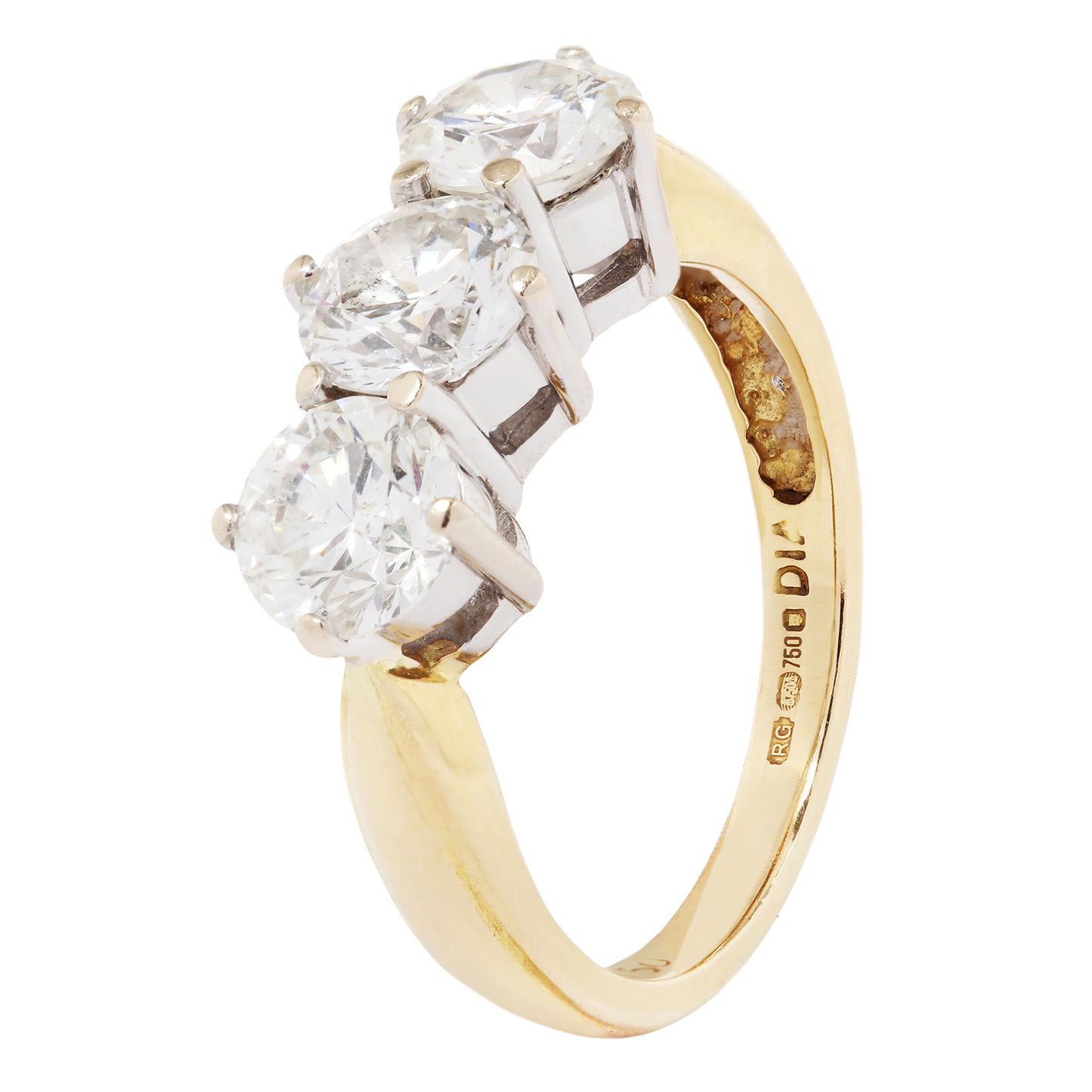 Gold ring with three diamonds on a white background