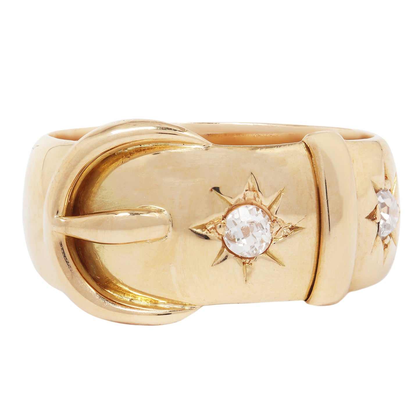 Gold ring with star-shaped gemstone on a white background