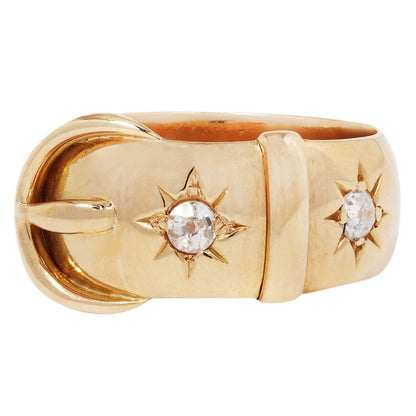 Gold ring with star designs and embedded stones on a white background