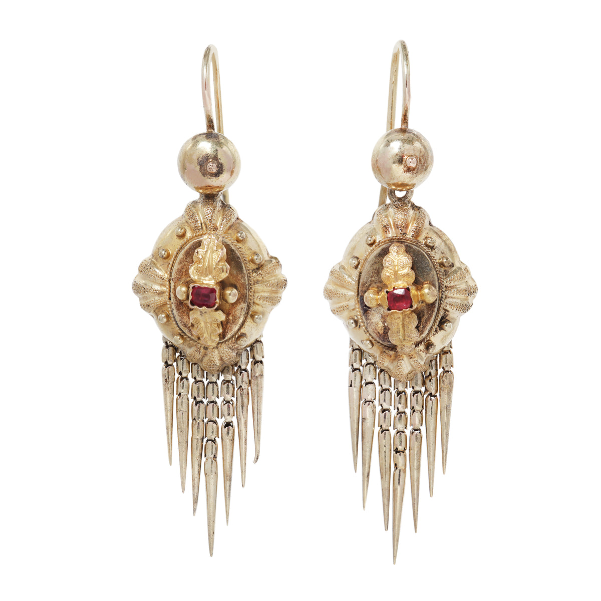 Antique gold earrings with ruby at the center and fringe at the bottom on white background