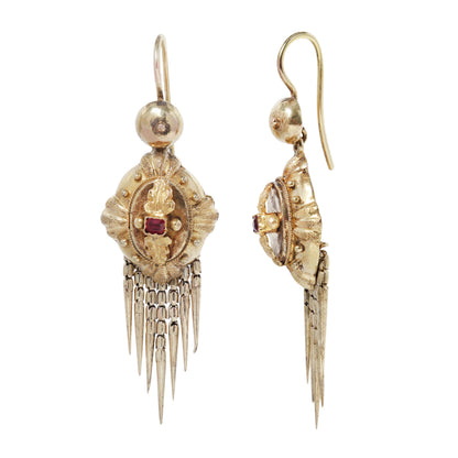 Antique gold earrings with ruby at the center and fringe at the bottom on white background