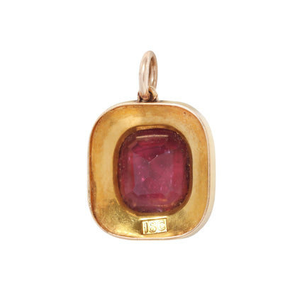 Antique pink red tourmaline and pearl necklace charm on a white background
