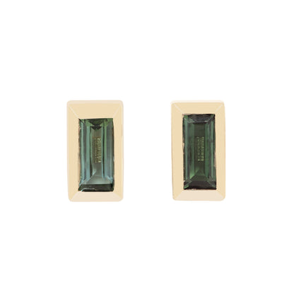 A pair of gold rectangular stud earrings with emerald-cut green gemstones, shown against a plain white background.