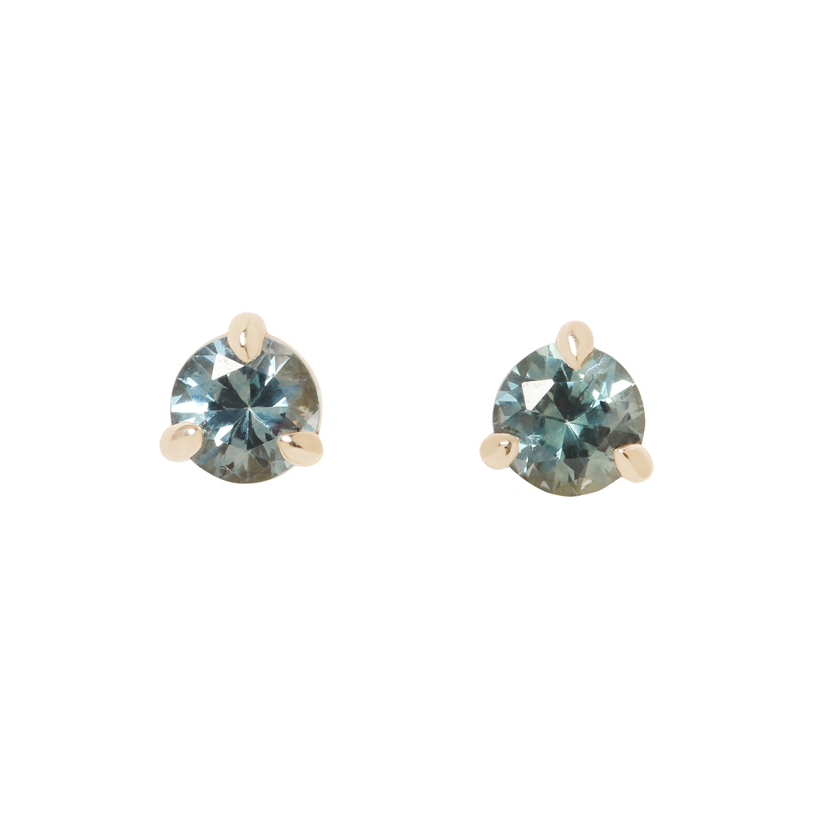 two small gold stud earrings with blue sapphires, against a white background.