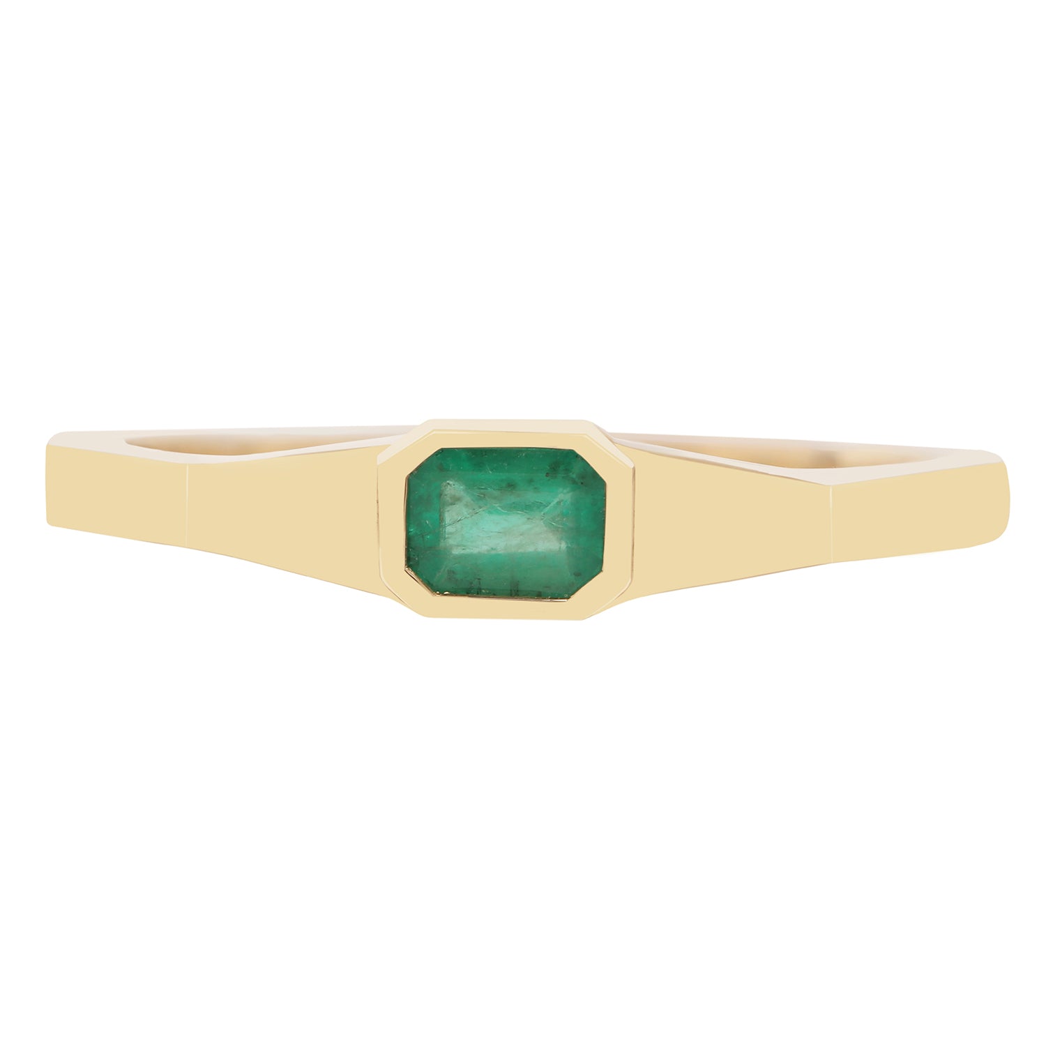 Gold ring with a green gemstone on a white background