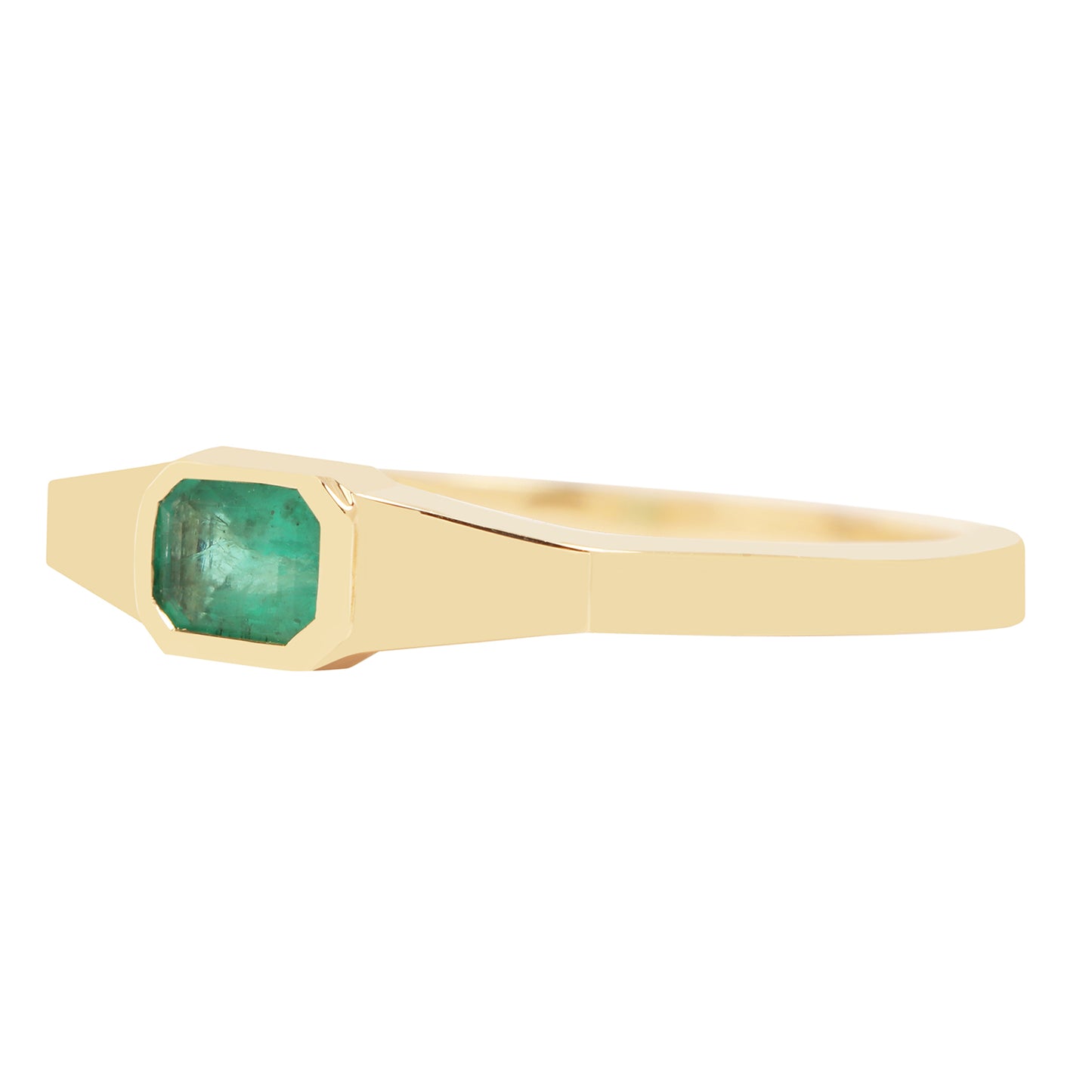 Gold ring with a green gemstone on a white background