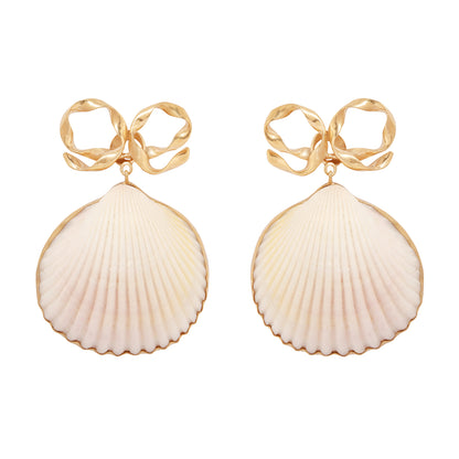 Shell-shaped earrings with gold accents on a white background