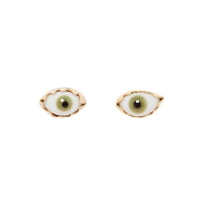 Glass green eye stud earrings on a white background