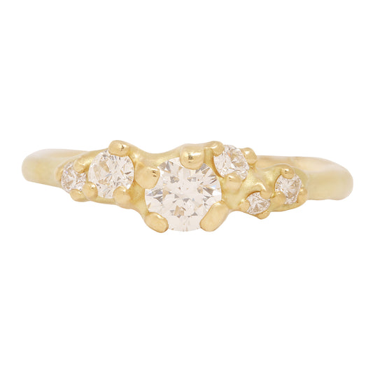 Johnny Ninos - Gold ring with diamond stones on a white background