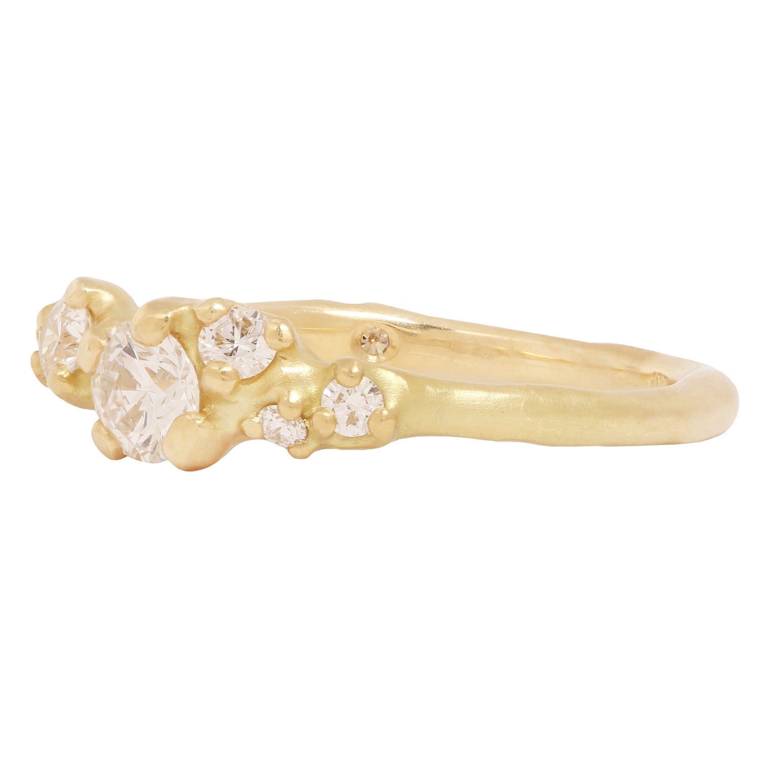 Johnny Ninos - Gold ring with embedded diamonds on a white background
