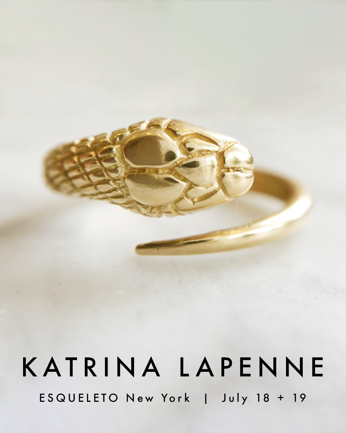 Gold bracelet with intricate design on a white background, featuring the brand 'Katrina LaPenne'.