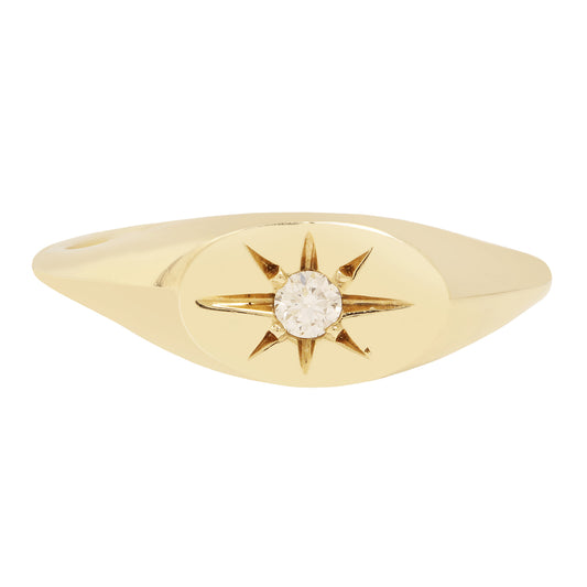 ladha - Gold ring with a diamond and star design on a white background