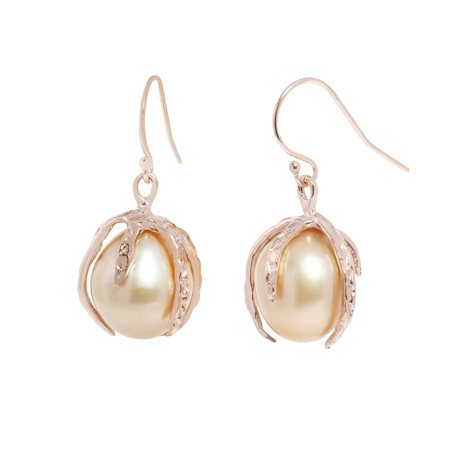 A pair of gold drop earrings featuring large, lustrous baroque pearls nestled in textured, claw-like gold settings, shown against a plain white background.