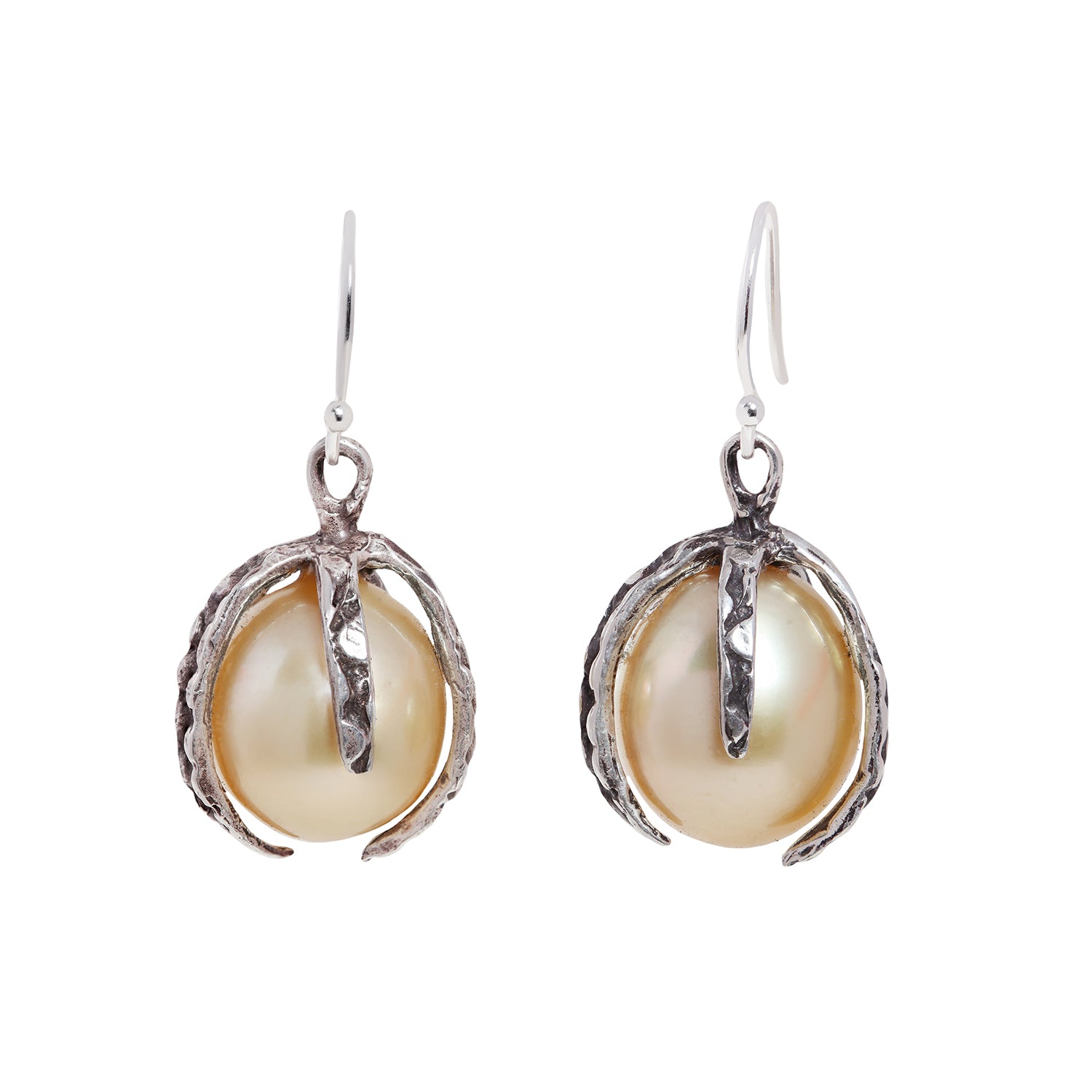 A pair of darkened silver drop earrings featuring large, lustrous baroque pearls nestled in textured, claw-like settings, shown against a plain white background.