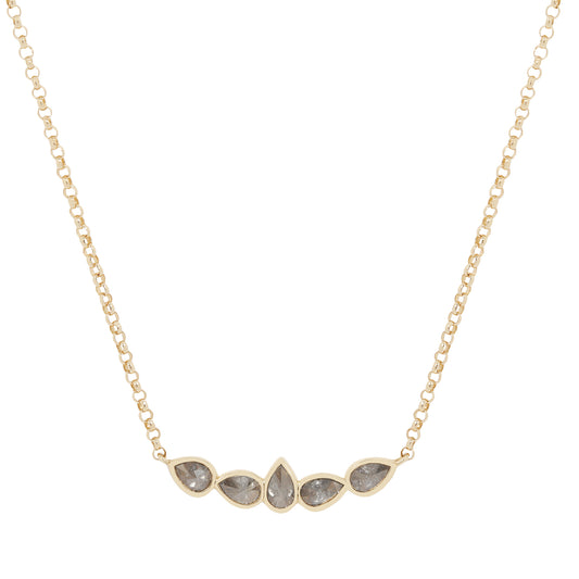 Gold necklace with five teardrop-shaped stones on a white background