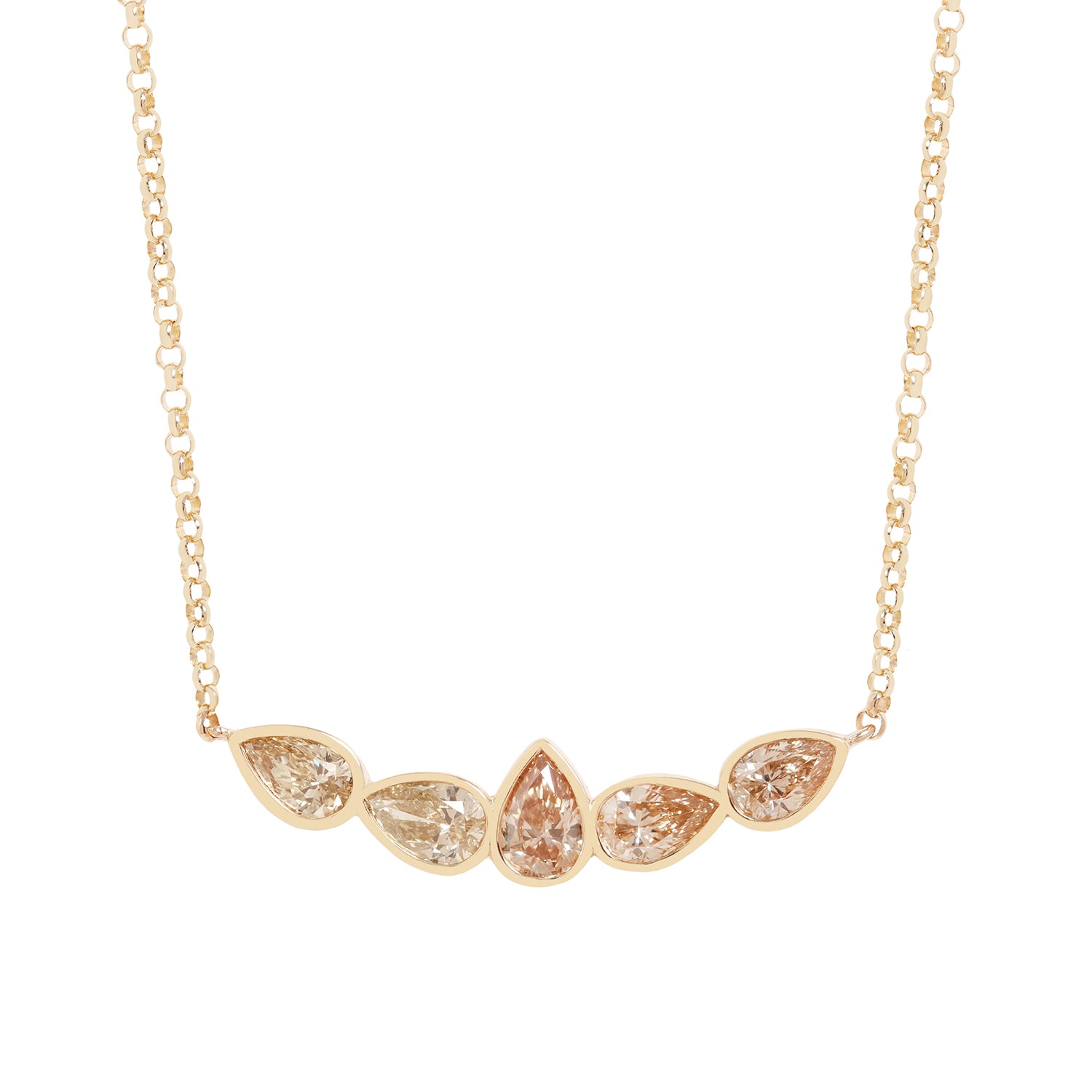 A gold necklace featuring five pear-cut clear gemstones in a row, with the center stone being teardrop-shaped. The stones are set in a yellow gold chain on a solid white background.