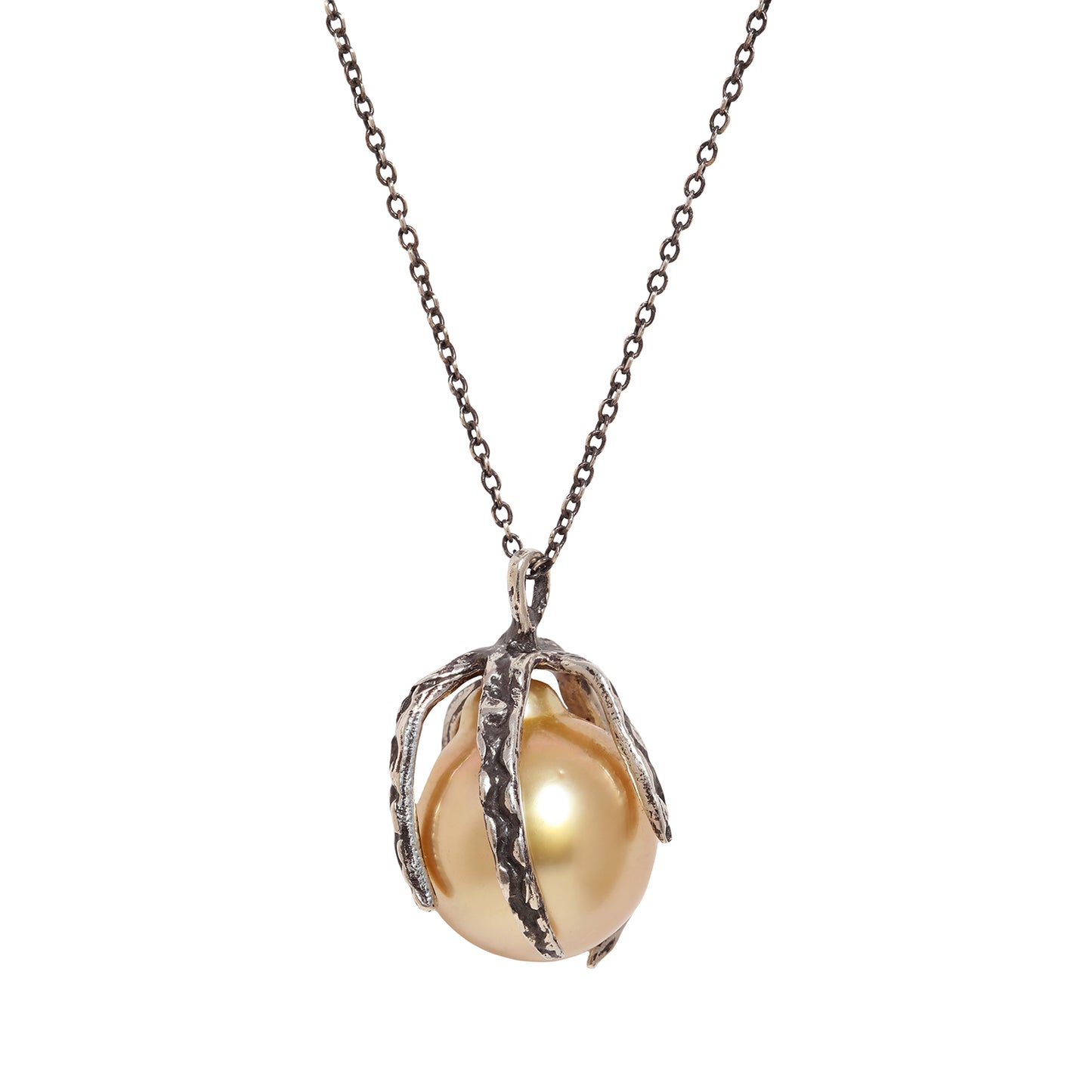 A necklace featuring a large, lustrous gold-toned pearl nestled within an oxidized silver claw setting, suspended from a matching silver chain against a plain white background.
