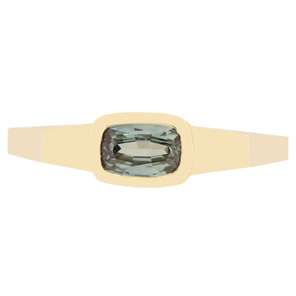 Lauren Wolf - Gold ring with a green gemstone on a white background