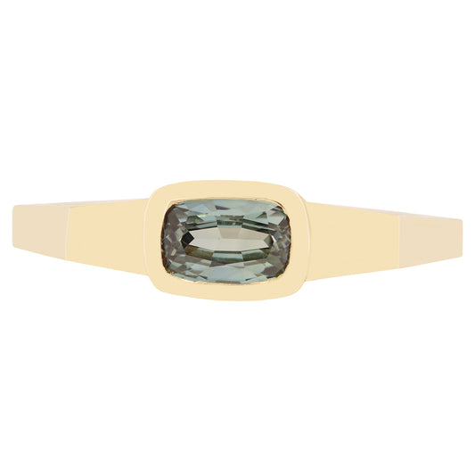 Lauren Wolf - Gold ring with a green gemstone on a white background