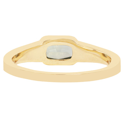 Lauren Wolf - Gold ring with a central stone on a white background