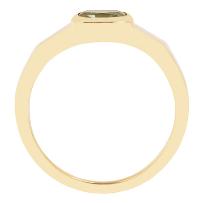 Lauren Wolf - Gold ring with a green gemstone on a white background