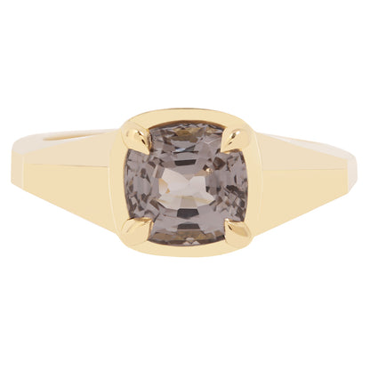 Lauren Wolf - Gold ring with a smoky gemstone on a white background